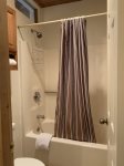 Bathroom shower/bath and toilet